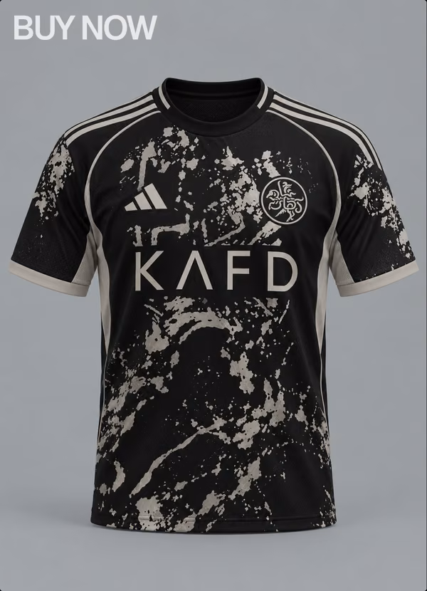 Black Nassr FC KAFD jersey with cream splatter, front.